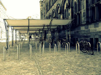 Bicycles on street against buildings in city