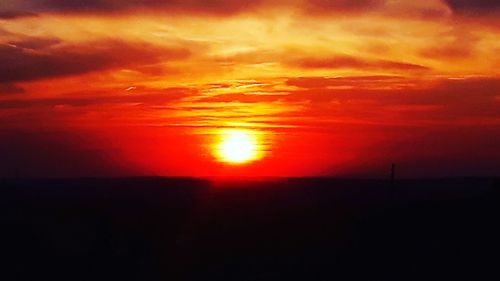 Scenic view of dramatic sky during sunset