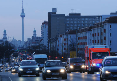 Traffic on city street with buildings in background