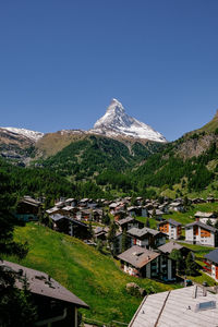 Scenic view of snowcapped mountains against clear sky