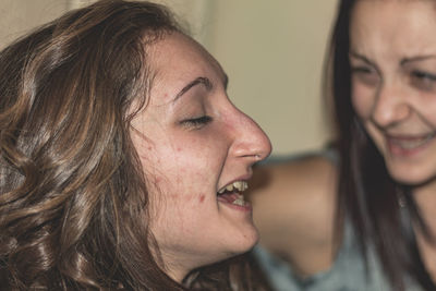 Close-up portrait of a smiling young woman