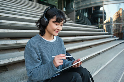 Young woman using mobile phone