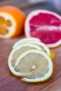 Close-up of citrus fruits on cutting board