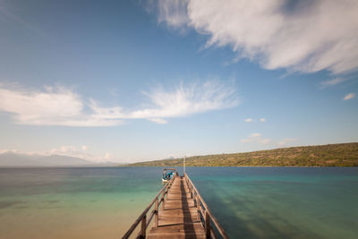 Pier over sea against sky