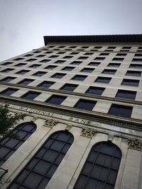 Low angle view of office building against sky