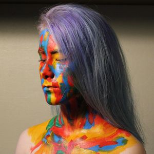 Portrait of woman with multi colored light painting