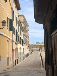 Alley amidst buildings in city