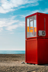 Red lifeguard station on the beach