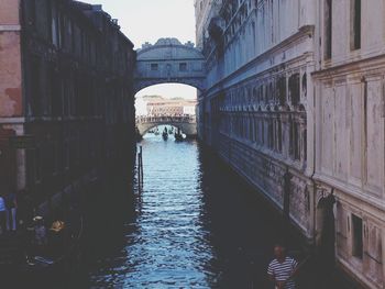 View of canal amidst buildings