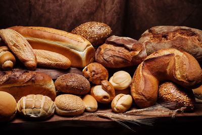 Close-up of various breads on table