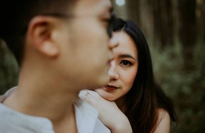 Close-up of couple standing outdoors