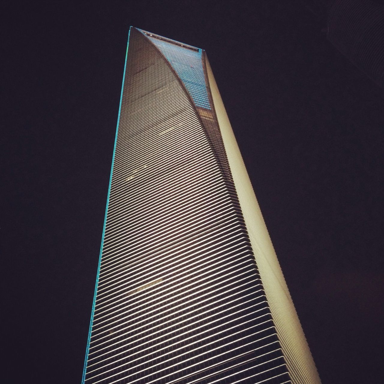 low angle view, architecture, modern, built structure, skyscraper, building exterior, pattern, tall - high, night, office building, building, illuminated, tower, no people, indoors, city, design, tall, clear sky, sky