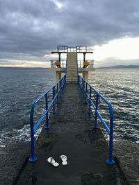 Pier over sea against sky