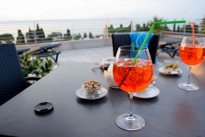 Close-up of wine glasses on table in restaurant