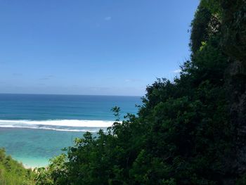 Scenic view of sea against clear blue sky