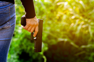 Close-up of man holding leaf