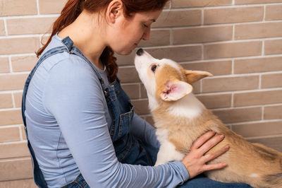 Midsection of man with dog