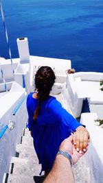 High angle view of woman sitting in swimming pool