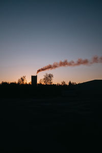 Scenic view of silhouette landscape against clear sky during sunset