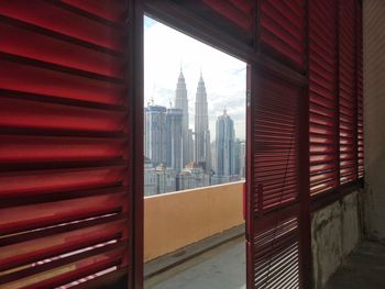 Buildings seen through glass window