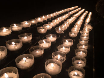 Lit candles in temple