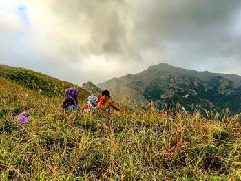 People on field against sky