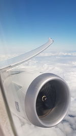 Airplane flying over blue sky