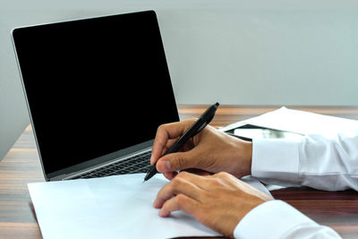 Man using laptop on table