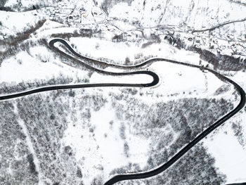 High angle view of snow covered car