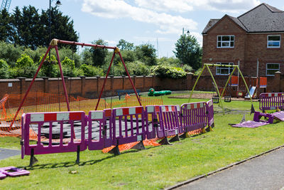 Empty playground against clear sky in park