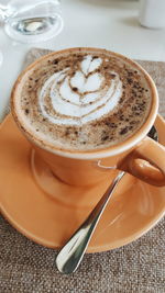 Close-up of cappuccino on table