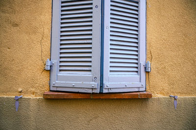 Blue window shutters