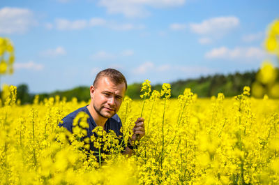 Portrait of a young man in the countryside