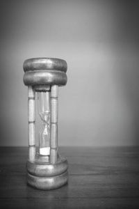 Close-up of clock on table at home