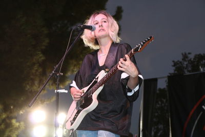 Young woman playing guitar