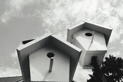 Low angle view of birdhouse against sky