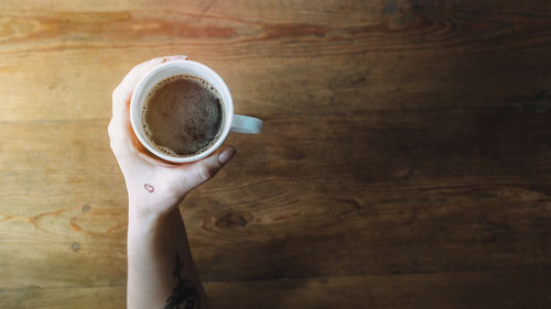 Close-up of coffee cup on table