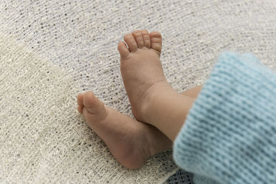 Closeup of a newborn baby feet with beautiful selective focus. concept for maternity and tenderness