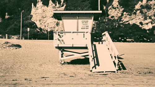 Empty chairs against trees