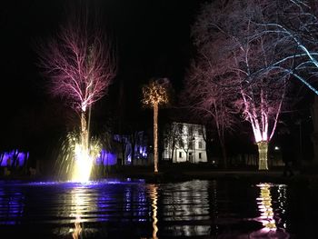 Reflection of illuminated buildings in water