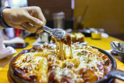 Close-up of hand holding ice cream