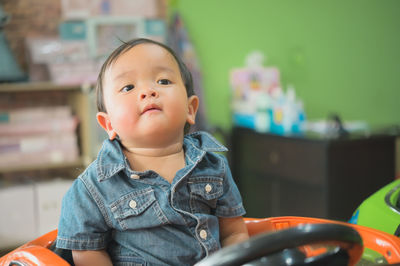 Portrait of cute boy looking away