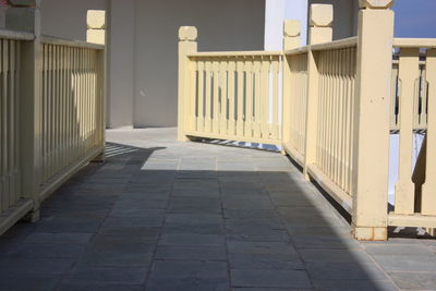 Empty pathway along railings