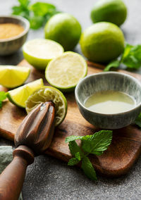 Lime, mint and ice on a dark background. the ingredients for making refreshing drinks and cocktails.