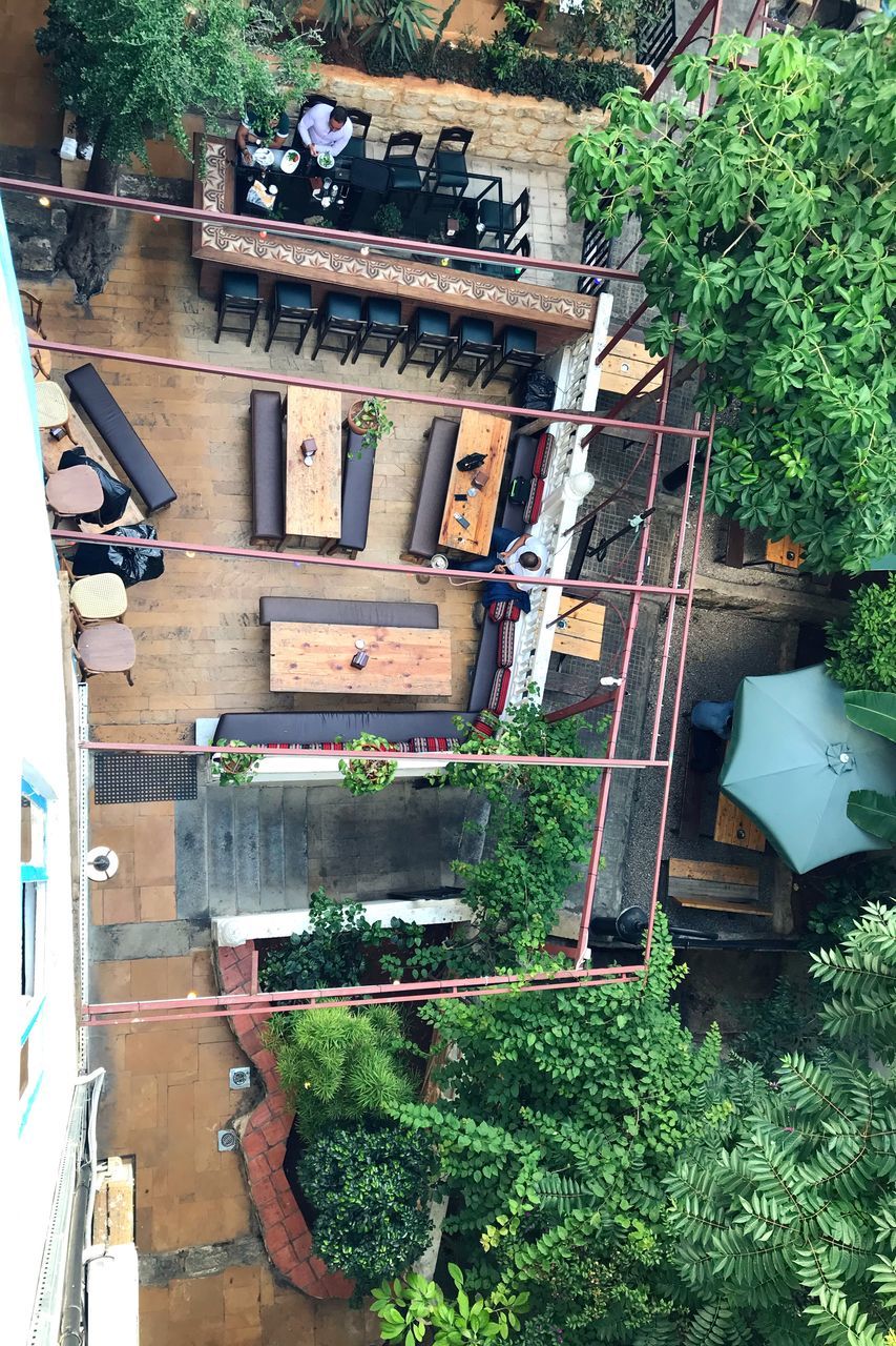 HIGH ANGLE VIEW OF BUILDING AMIDST TREES