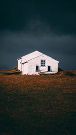 House on field against sky