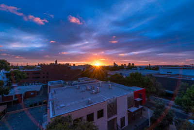 High angle view of buildings against sky during sunset