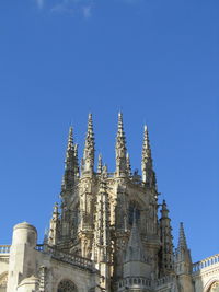 Low angle view of cathedral against clear blue sky