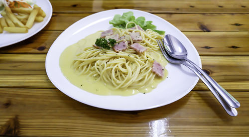 Close-up of noodles served on table
