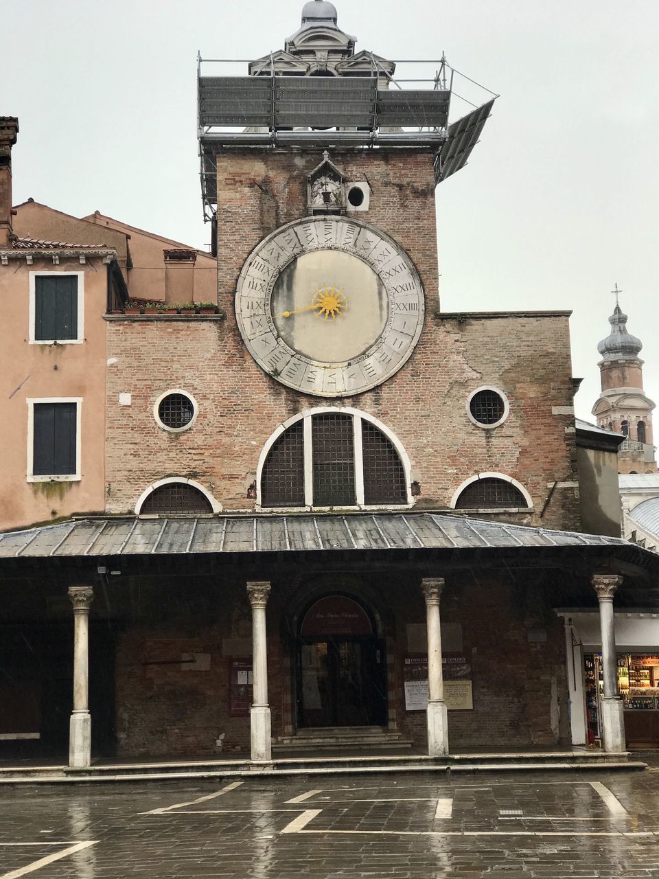 LOW ANGLE VIEW OF CLOCK TOWER AGAINST BUILDING